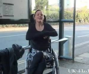 this girl in a wheelchair, shows in public her bald pussy and large boobs.
